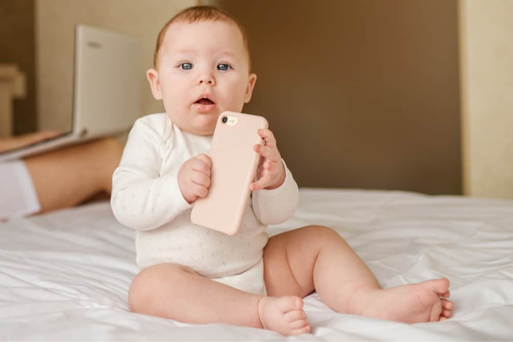 Baby holding smartphone