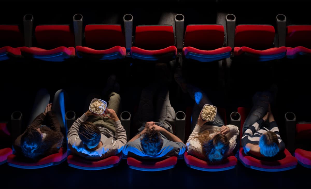 Group of young adults in movie theatre