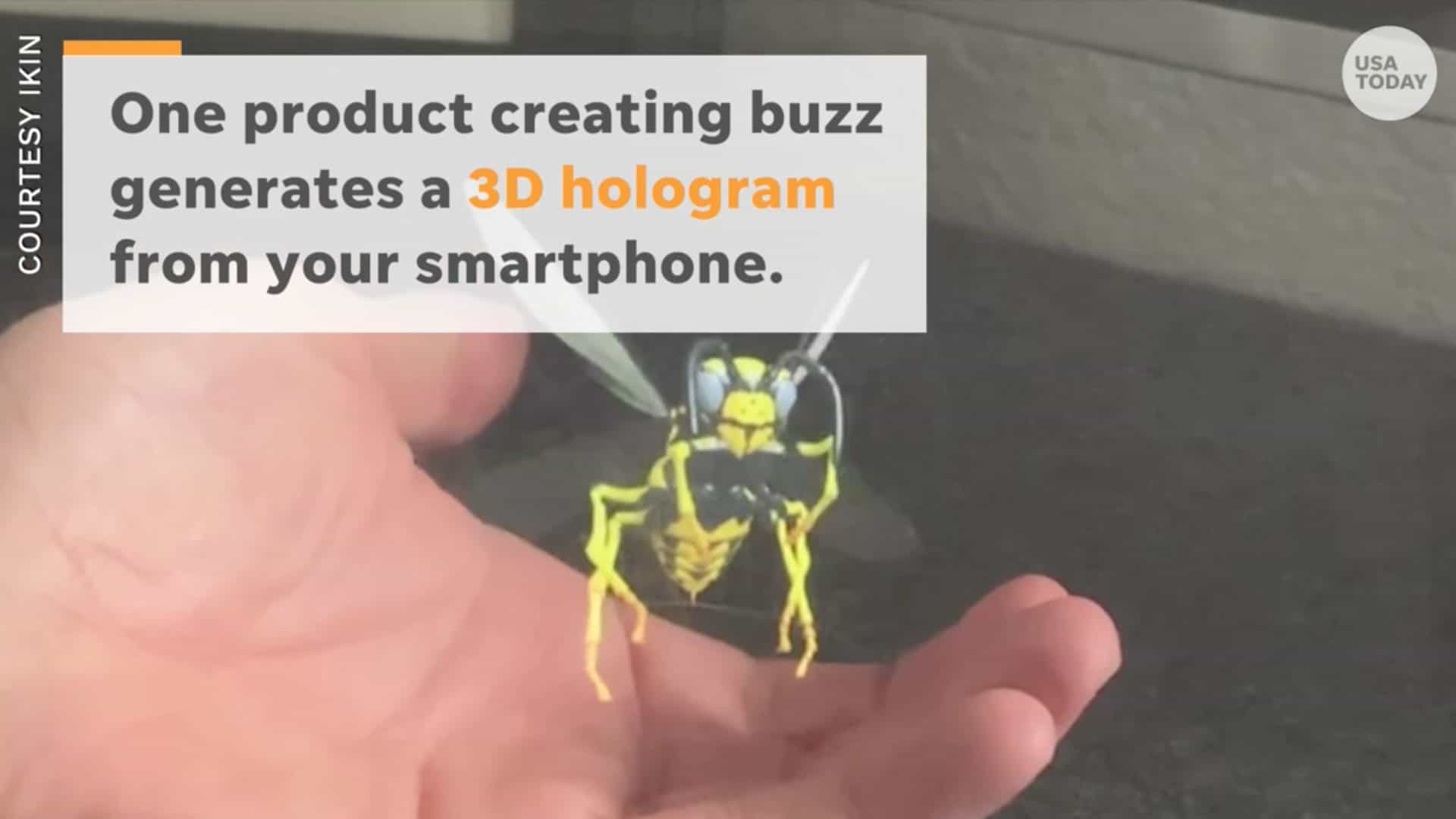 IKIN RYZ holographic wasp with human hand cradled underneath
