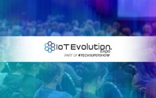 IoT Evolution Expo Logo with background image showing crowd of attendees
