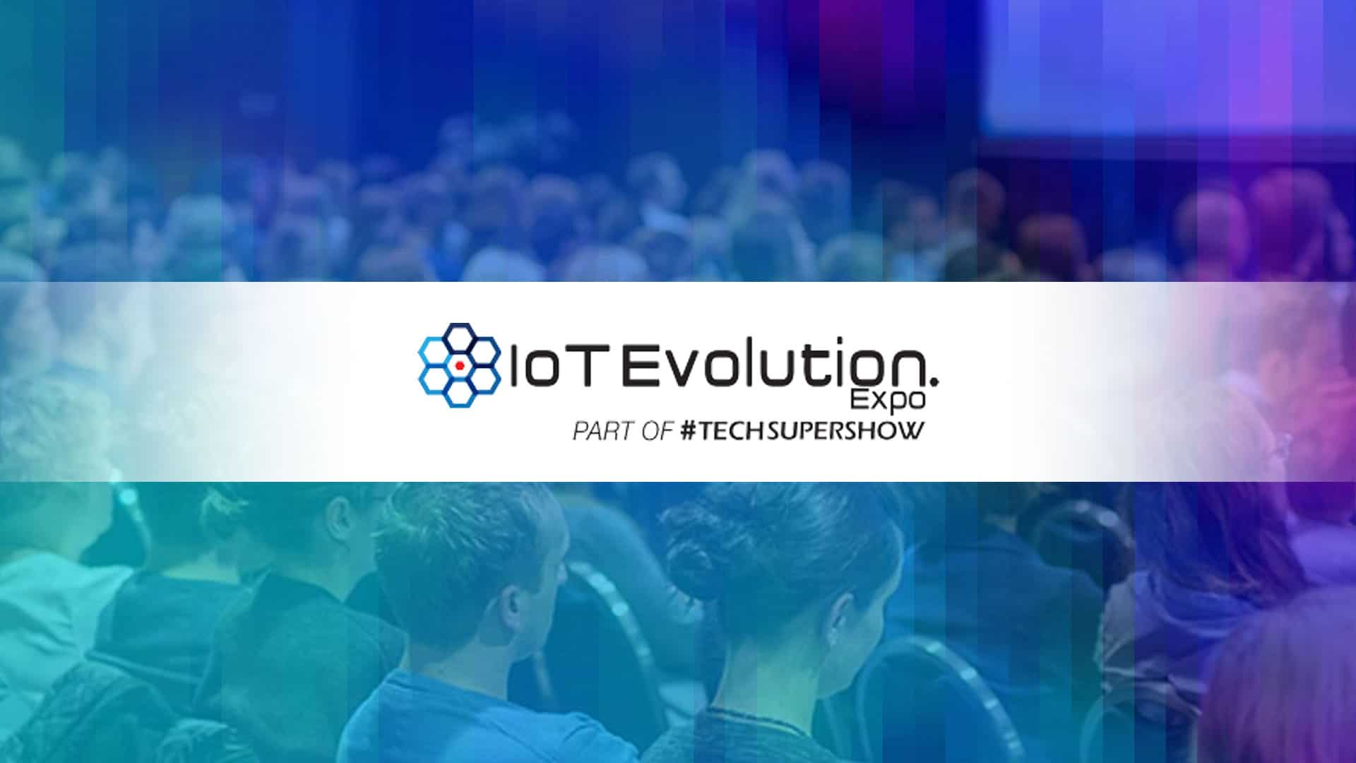 IoT Evolution Expo Logo with background image showing crowd of attendees